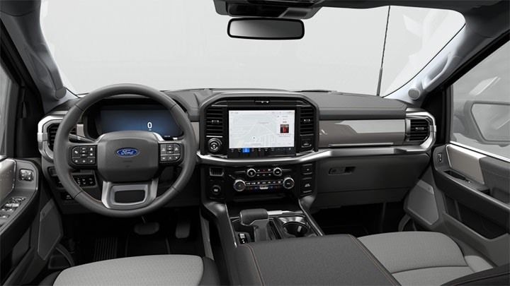 Tablero de la Ford F-150 con volante, panel digital y pantalla multimedia central.